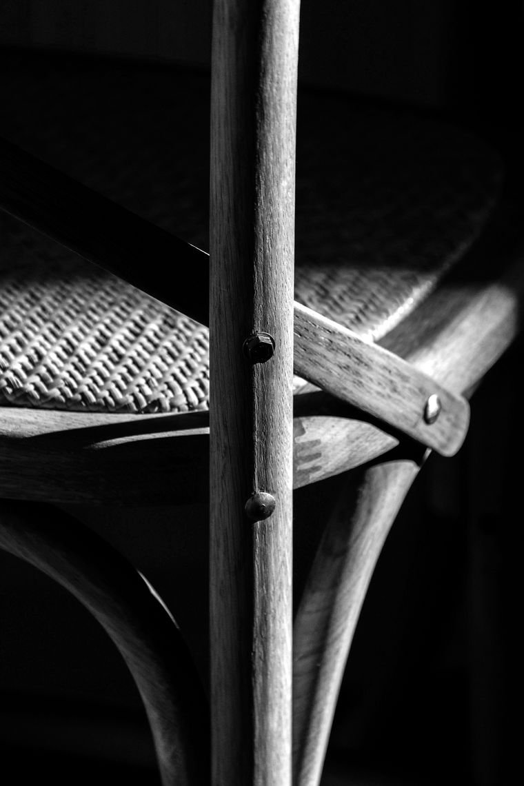 A close detail of a wooden chair joint