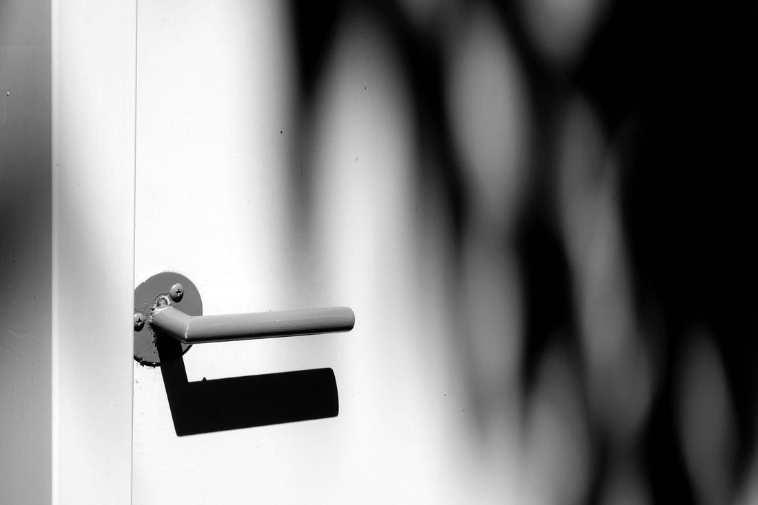 A door handle catching low afternoon light